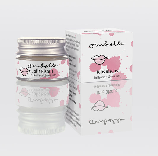 Ombelle Jolis Bisous Lippenbalsam 5g im Glastiegel mit Metalldeckel mit natürlichem Jasminwachs und Vitamin E. Daneben ist das Foto von dem Faltschachtel.