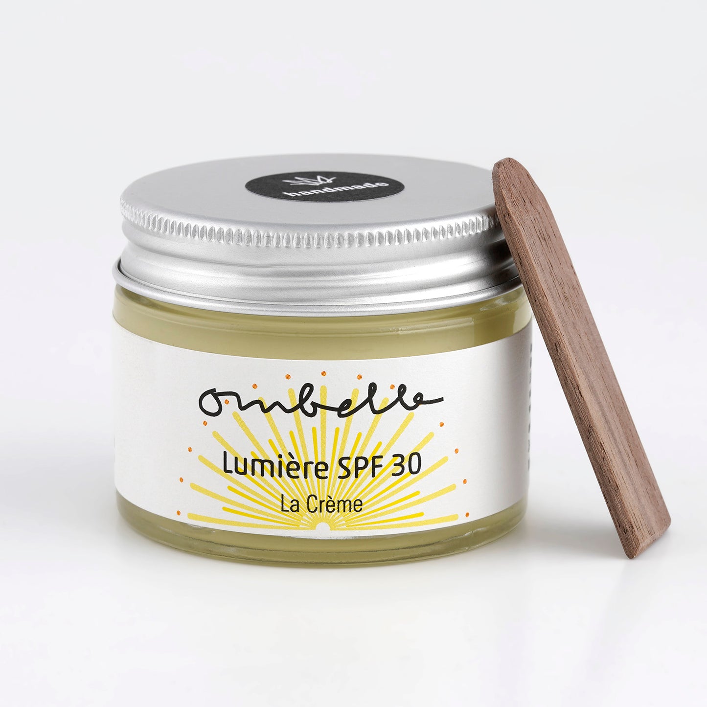 Vegane und palmölfreie Sonnencreme mit LSF 30, mikroplastikfrei und Korallenfreundlich. Im Glastiegel mit Holzspatel